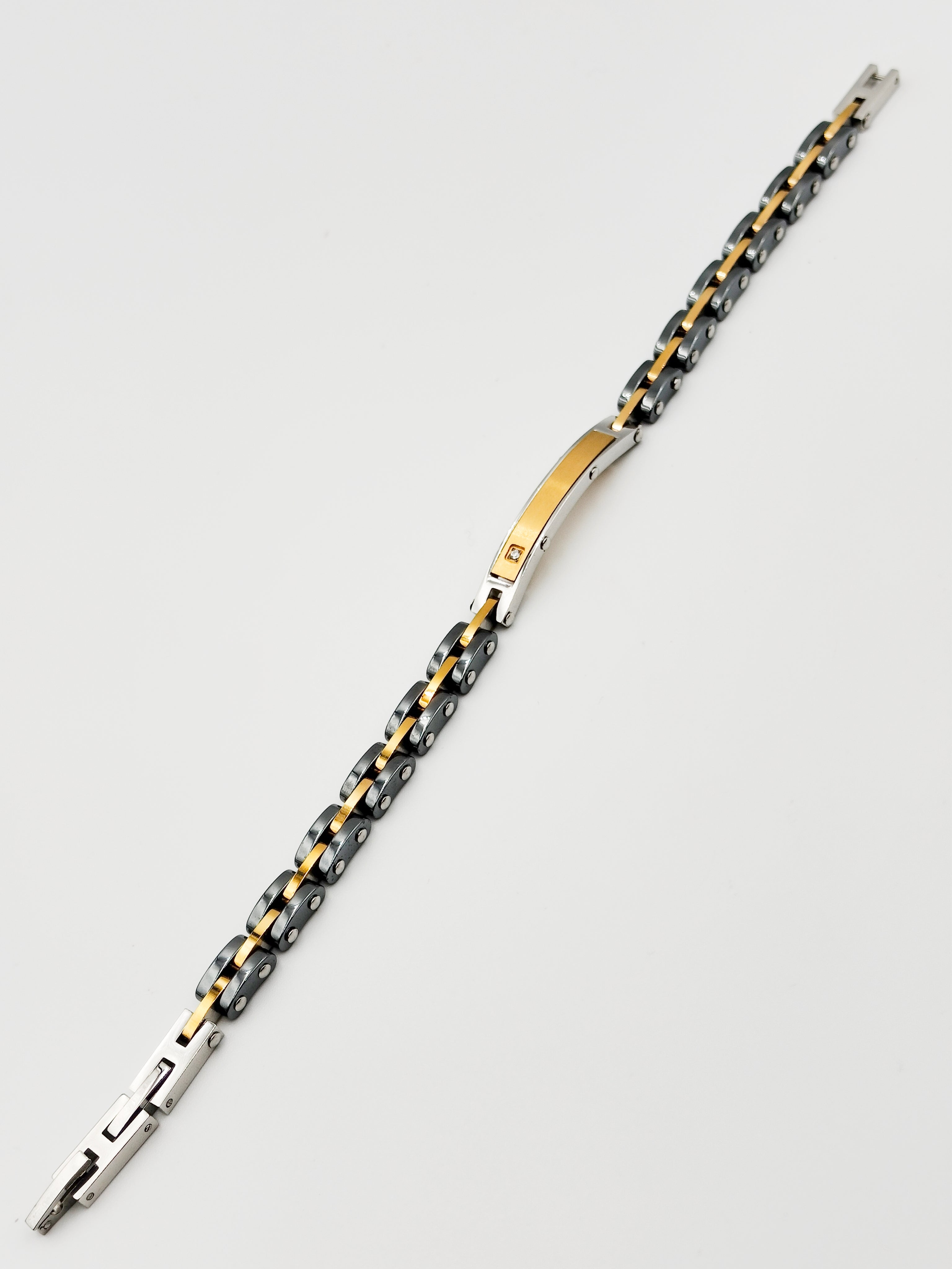 bracciale in acciaio e ceramica con piastrina gold