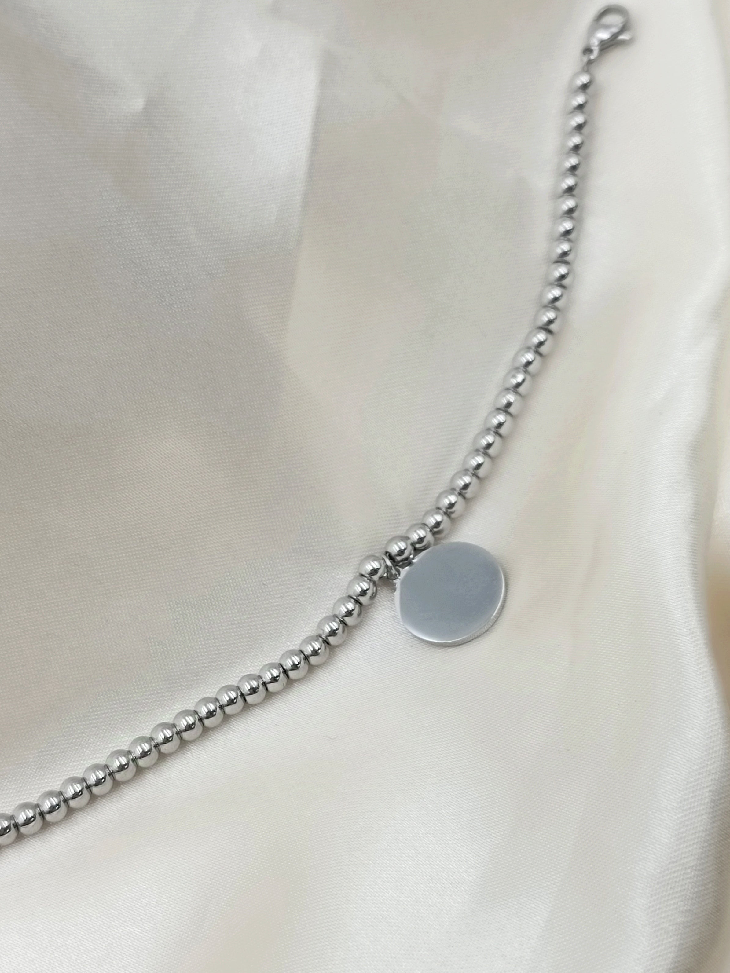 bracciale palline e tondo in acciaio