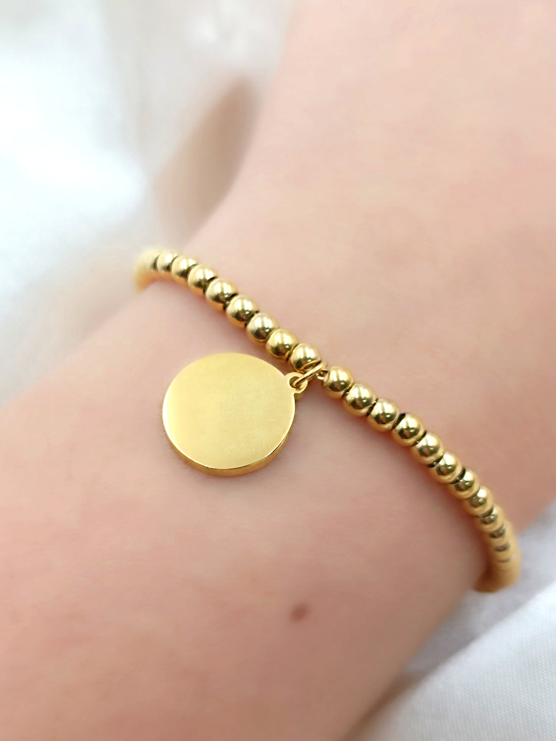 bracciale palline e tondo in acciaio gold